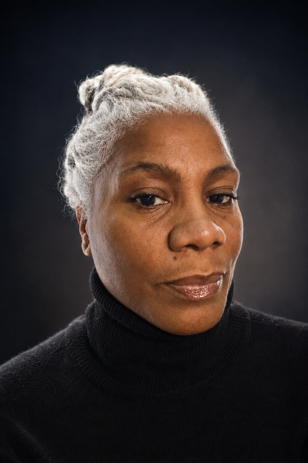 Professional portrait of Cariol Horne with silver braids