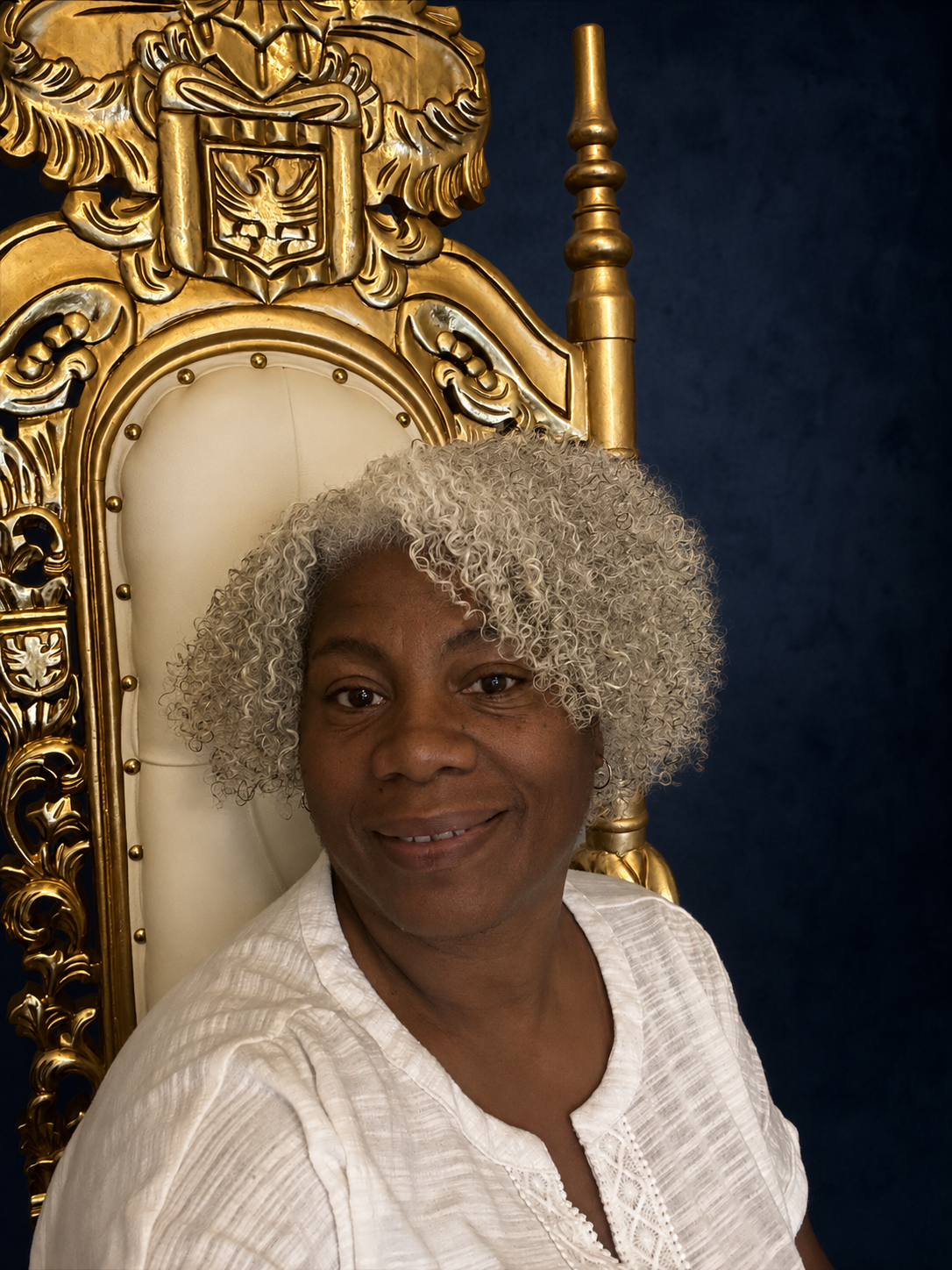 Cariol Horne seated in a gold ceremonial chair