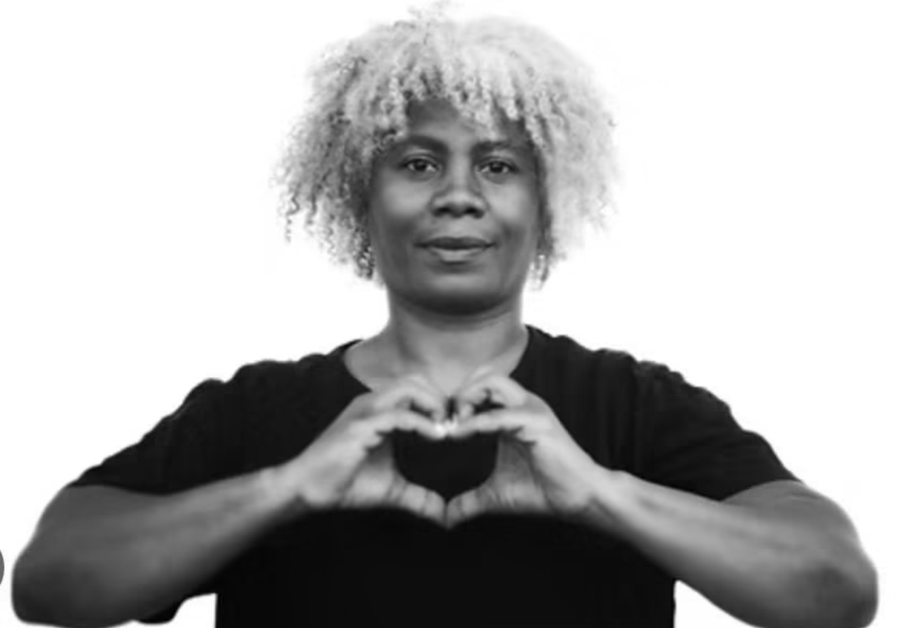 Cariol Horne making a heart shape with her hands